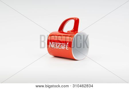 Kuala Lumpur, Malaysia - July 03, 2019:  Promotional Red Nescafe Mug On White Background. Selective 