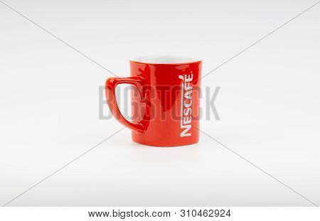 Kuala Lumpur, Malaysia - July 03, 2019:  Promotional Red Nescafe Mug On White Background. Selective 