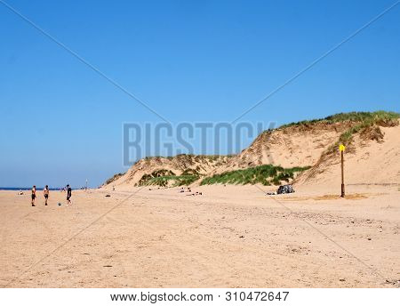 Formby, Merseyside, United Kingdom - 28 June 2019: A View Of The Long Sandy Beach In Formby Merseysi