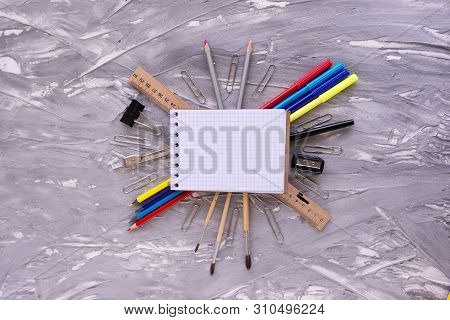 Accessories For Study. Stationery For School And Offices. Goods Supply. Notebook Lies Surrounded By 