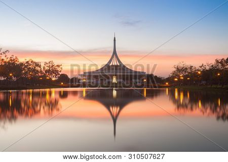 Monument In Public Park Of Thailand. Twilight Shooting Reflection On Water Concept At The Suanluang 
