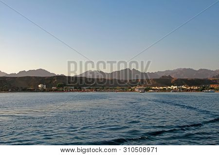 Red Sea Coast In Sharm El Sheikh, Egypt, Sinai, View Of The Pier, Where The Excursion Boats And The 