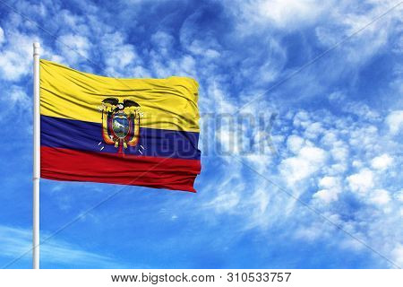 National Flag Of Ecuador On A Flagpole In Front Of Blue Sky