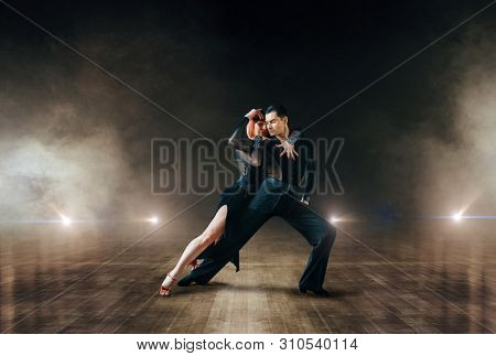 Elegant dancers, ballrom dance on theatre stage