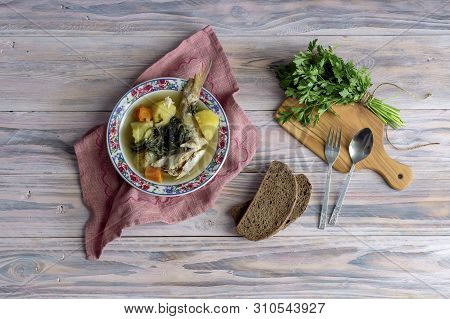 Ready Meals. Fish Soup In A Plate From Grouper (epinephelus Aeneus) On A Wooden Table Close-up