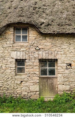 Old House In Saint Lyphard (france) With A Thatched Roof