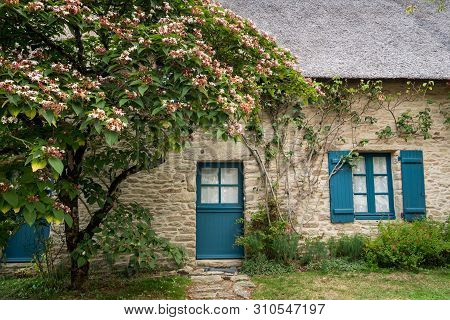 Old House In Saint Lyphard (france) With A Thatched Roof