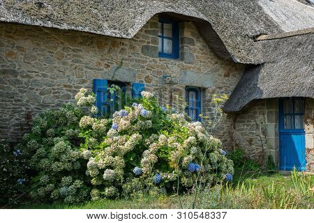 Old House In Saint Lyphard (france) With A Thatched Roof