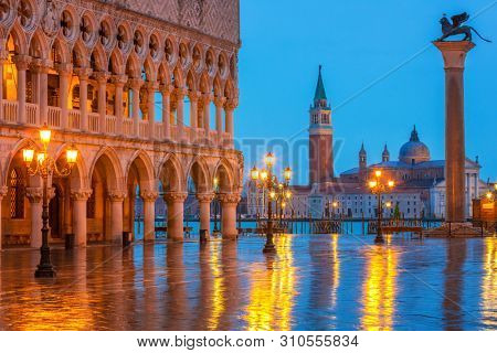Piazza San Marco at night, view on venetian lion and san giorgio maggiore, Vinice, Italy