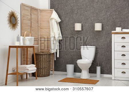 Ceramic Toilet Bowl In Stylish Bathroom. Idea For Interior Design