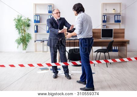 Forensic investigator investigating theft in the office