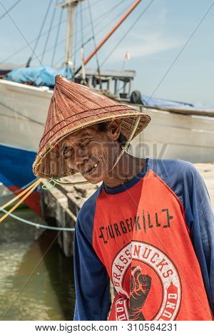 Makassar, Sulawesi, Indonesia - February 28, 2019: Paotere Old Port. Closeup Of Old Man Dock Worker 