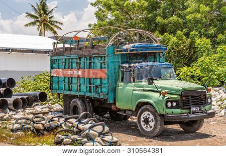 Makassar, Sulawesi, Indonesia - February 28, 2019: Paotere Old Port. Closeup Of Old Green Truck Park