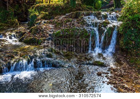 Cascade of waterfalls on the river. The small Croatian town of Slunj. The forest surround the river. The concept of ecological, active and photo tourism