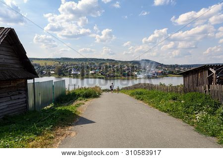 Country Road Leading To The Lake. Village Of Visim, Sverdlovsk Region, Ural, Russia.