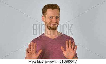 Serious Caucasian Guy With Red Hair Showing Emotion Disgusting. Handsome Redheaded Men Wearing In Ca