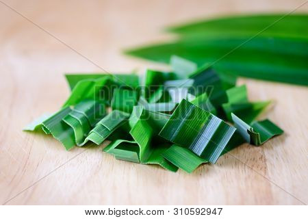 Sliced Pandan Leaf On Cutting Board Preparing For Cooking, Pandan Leaf Used To Enhance The Flavoring