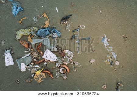 Trash, Plastic, Garbage, Bottle... Environmental Pollution On Sandy Beach. Royalty High-quality Stoc