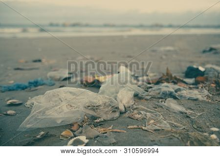 Trash, Plastic, Garbage, Bottle... Environmental Pollution On Sandy Beach. Royalty High-quality Stoc