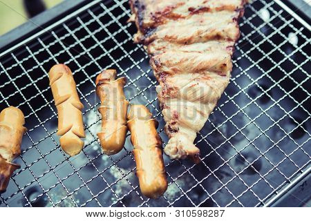 Close Up Grill With Meat And Sausage Ready For Socializing Celebrate At Outsite Home.