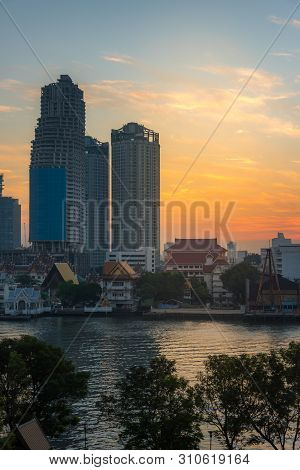 Bangkok Cityscape With Waterfront Property And Unfinished Skyscraper Construction. Property Crysis I