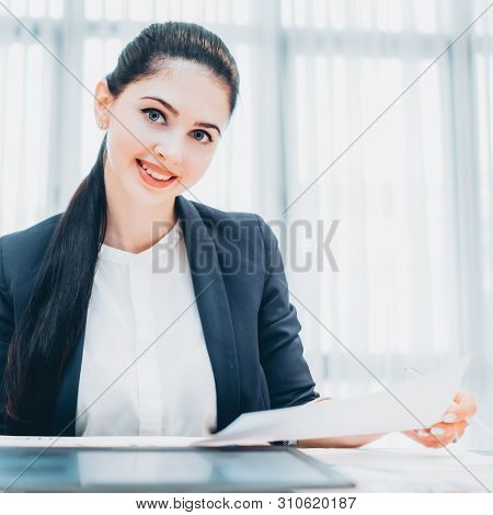 Human Resources. Portrait Of Cheerful Female Recruiter Reviewing Resume During Interview.
