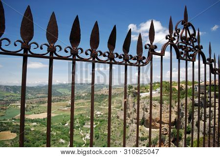 Ornate Iron Fence Panel On The New Bridge With Views Across The Spanish Countryside, Ronda, Malaga P