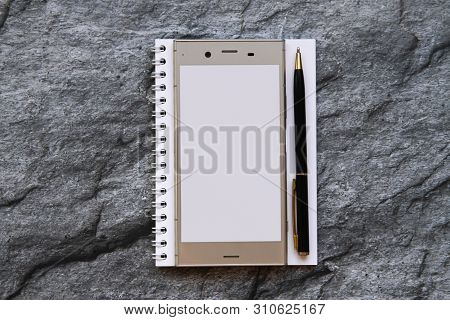 Blank Smartphone And Notebook. Still Life Mock-up