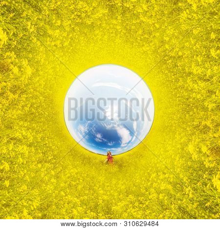 Woman In Yellow Colza Field In The Morning In The Fog At Sunrise Landscape. . Tiny Little Planet 360