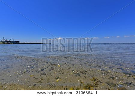 Calm In The Sea Bay. Berdyansk Spit Is Located In The North Of The Azov Sea, Separating The Gulf Of 