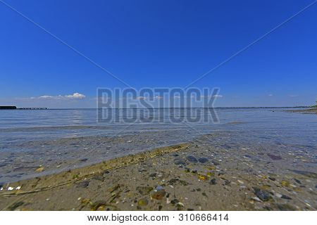Calm In The Sea Bay. Berdyansk Spit Is Located In The North Of The Azov Sea, Separating The Gulf Of 