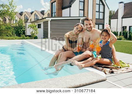 Happy Family,rented A House With A Swimming Pool And Enjoy The Summer Holiday. Father Mother And Dau
