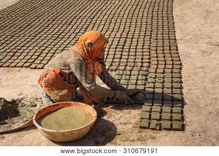 Ajmer, India - February 07, 2019: Indian Woman Makes Manual Clay Bricks