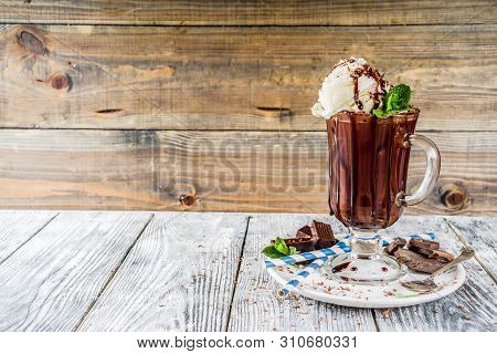 Iced Chocolate Cocktail. Cold Summer Sweet Drink With Cocoa, Vanilla Ice Cream Ball And Mint Leaves.