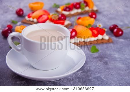 Cup Of Tea And Crisp Bread With Creme Cheese, Fruit And Berries