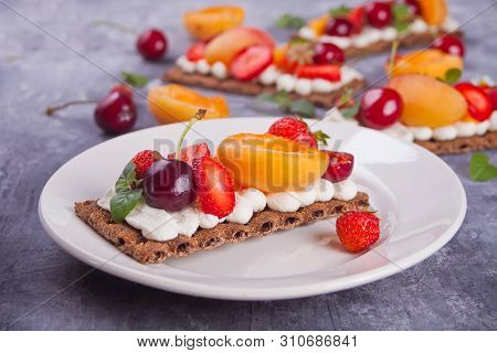 Crisp Bread With Creme Cheese, Fruit And Berries