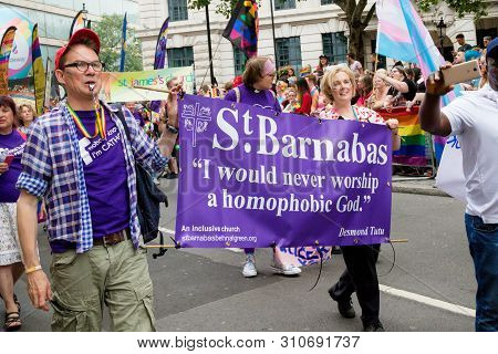 London, United Kingdom, 6th July 2019:- Participants From St Barnabas Church Holding A Banner Readin