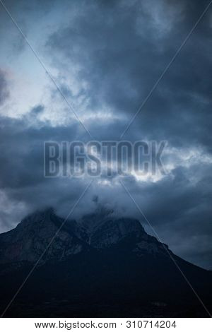 Mountain Peak Hidden By Cloudy Sky On Evening