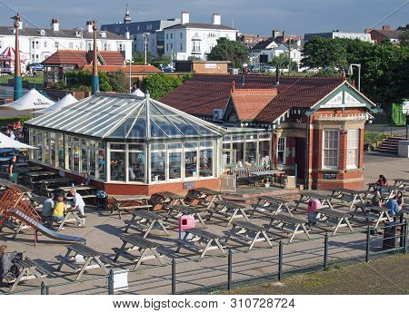 Southport, Merseyside, United Kingdom - 28 June 2019: People Relaxing In The Waterfront Cafe A Famou