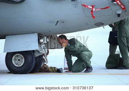 Otopeni, Romania - May 22, 2019: A Mechanic Is Inspecting Parts Of An Alenia C-27j Spartan Military 