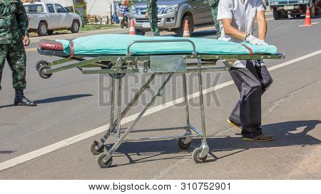 Wheelchair For Medical Evacuation Or Medevac For Rescue Team On Road