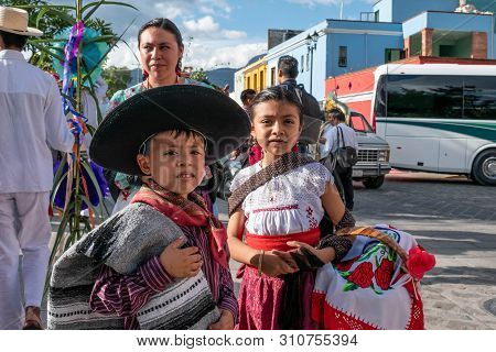 Oaxaca, Oaxaca, Mexico- July 6, 2019: Woman And Children Dressed With Traditional Clothes During The