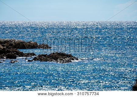 Holizontal Glitter - Glossy Sunlight Reflexion In The Sea Line And Open Sky.