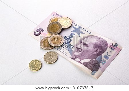 Turkish Banknotes And Coins. Turkish Lira Or Tl On White Background.