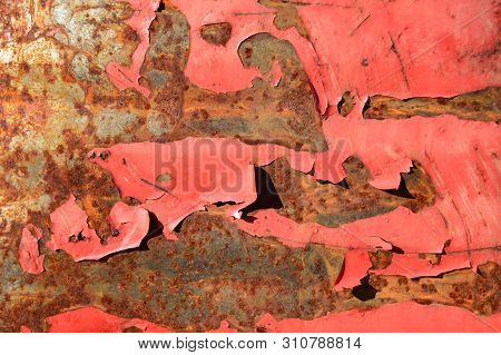 Rusty Metal Background With Red Paint Flaking. Close-up