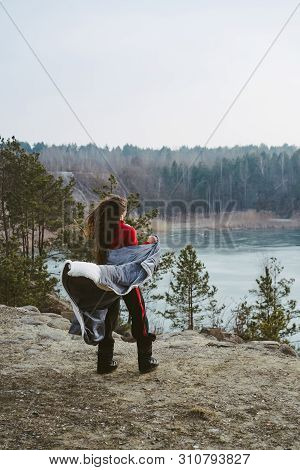Young Beautiful Girl Posing On A Background Of Lake