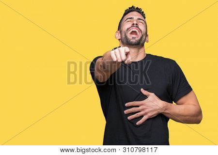 Young handsome man over isolated background Laughing of you, pointing to the camera with finger hand over chest, shame expression