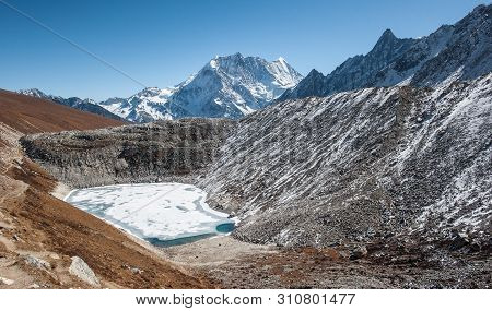Frozen Lake On The Way To The Pass On Manaslu Circuit With View Of Mount Manaslu Range 8 156 Meters.