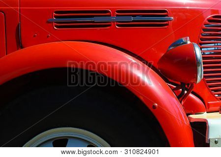 Detail Of Red Vintage Firetruck Tires, Light, Fender And Cooler
