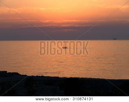 Sevastopol, Crimea - July 19, 2008: The Peninsula Of Crimea And Black Sea. Scarlet Sunset With Ships